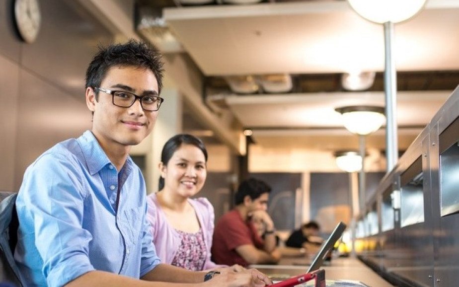 Two students smiling