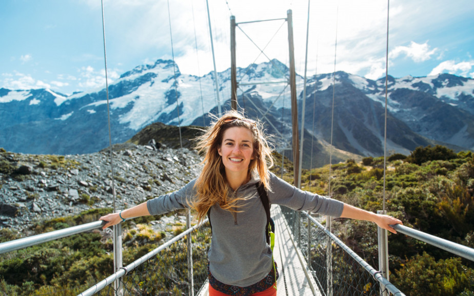 Smiling woman on bridge